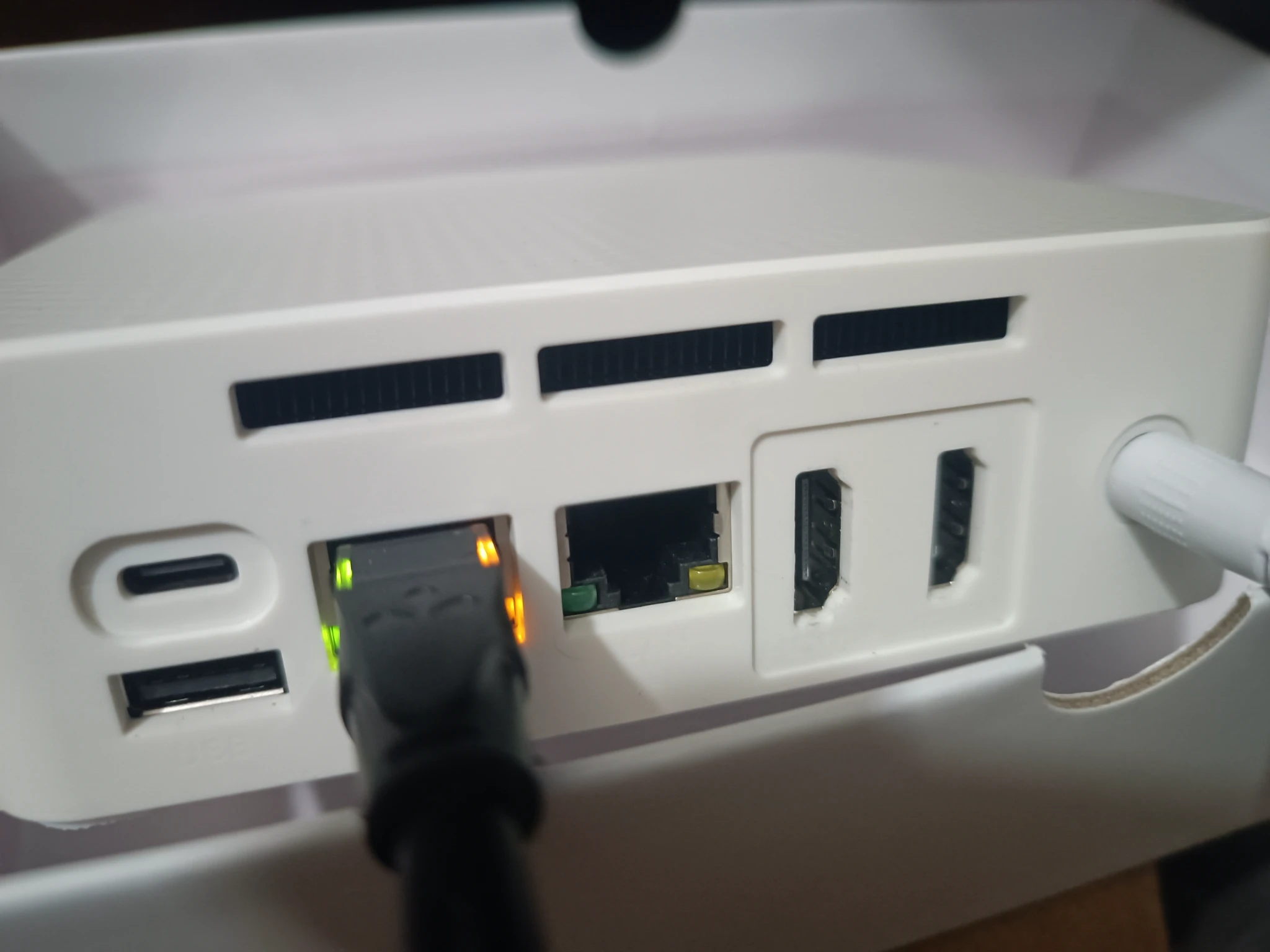 新到一台n100迷你小主机，搭建网站外网访问怎样做成本最低？
